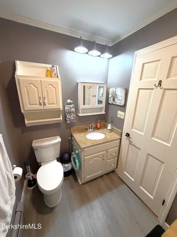 a bathroom with a toilet a sink and a bathtub