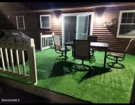 a backyard of a house with seating space