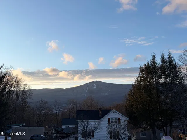 a view of house with mountain view