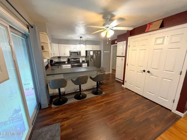 a room with wooden floor and furniture