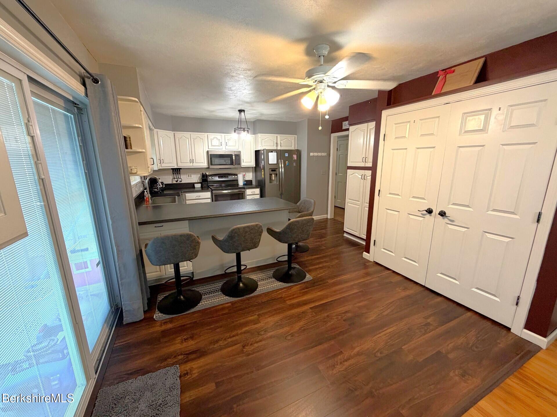8 Country Road Adams, MA 01220 - Photo 10 of 44 a room with wooden floor and furniture