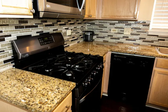a kitchen with a stove and a refrigerator