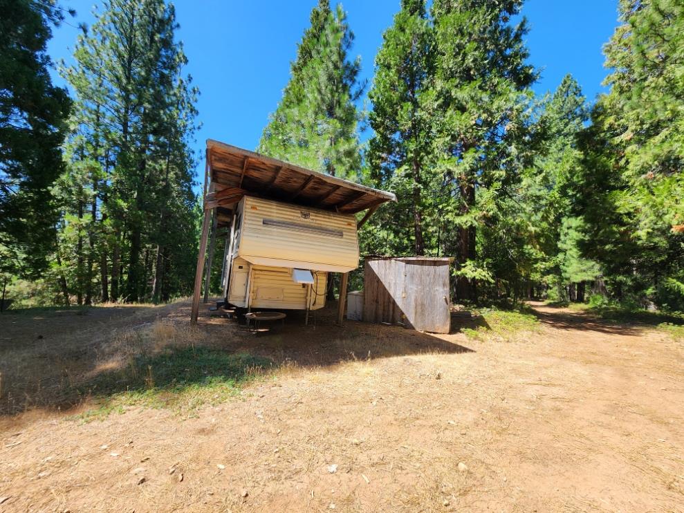 0 Lily Valley Way West Point, CA 95255 - Photo 30 of 45 a view of backyard with a small cabin and wooden fence