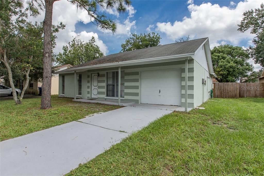 3752 Murrow Street New Port Richey, FL 34655 - Photo 1 of 1 front view of house with a yard