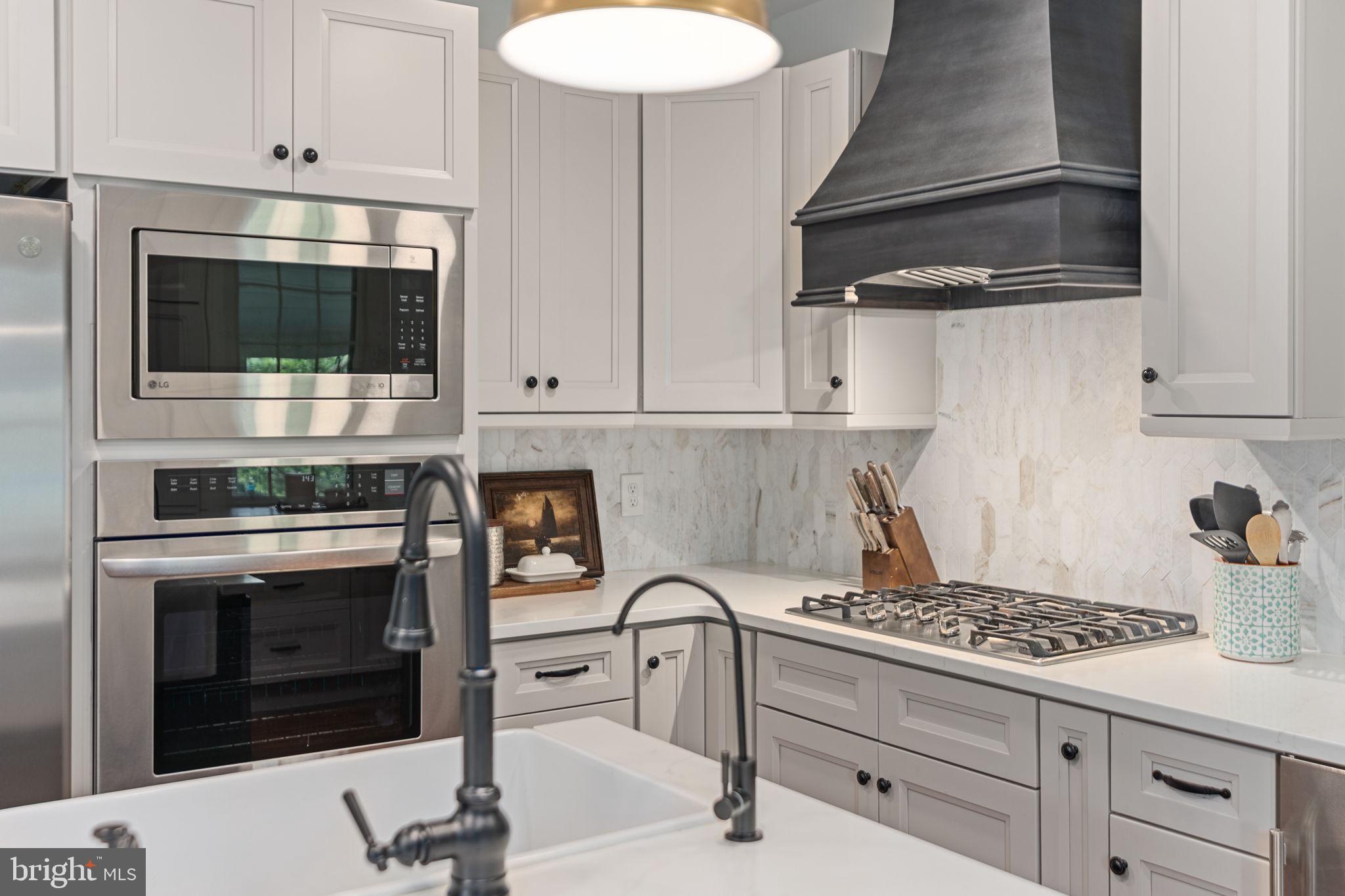 137 Callowhill Road Chalfont, PA 18914 - Photo 21 of 59 a kitchen with granite countertop a stove and a sink