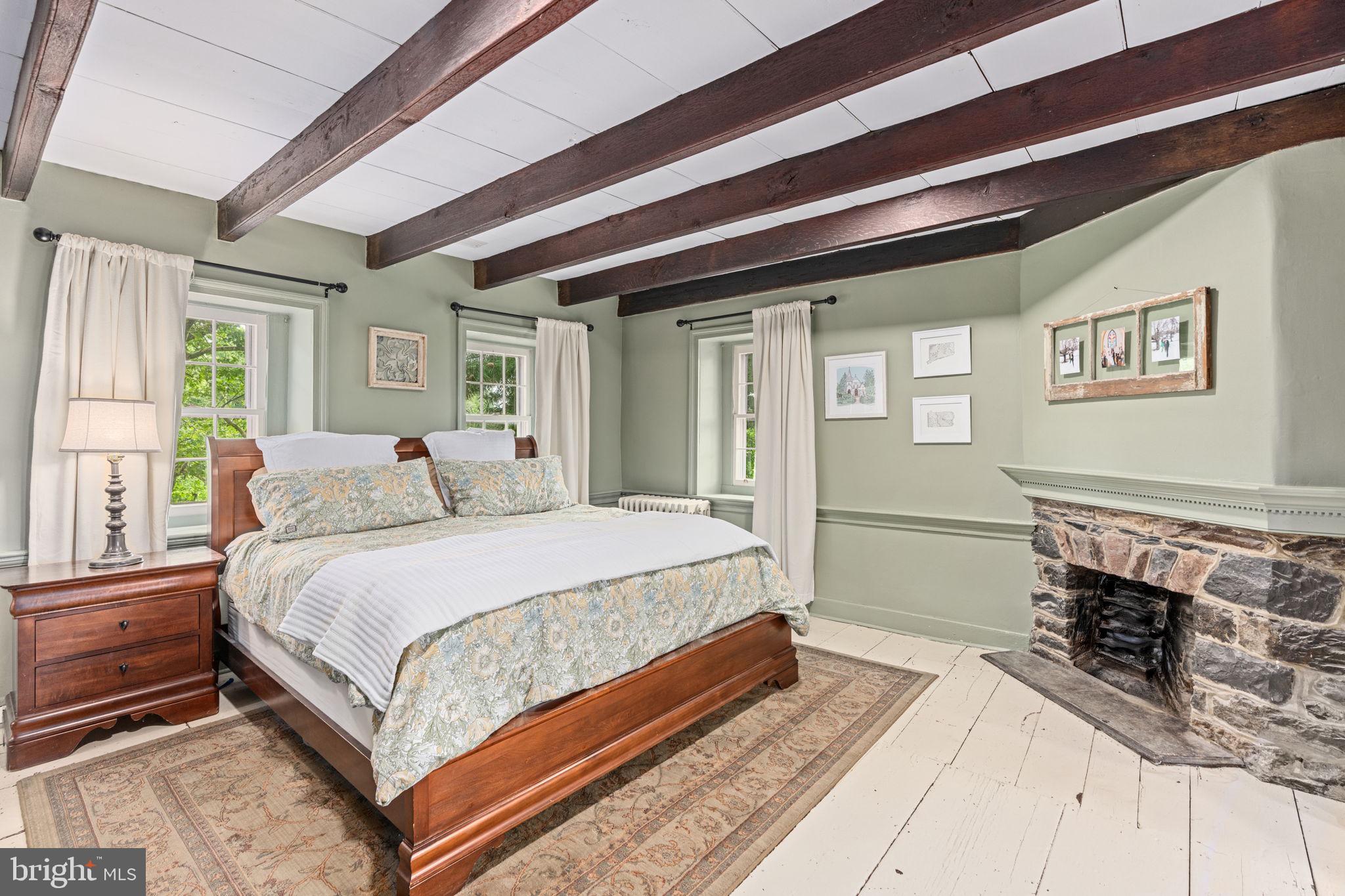 137 Callowhill Road Chalfont, PA 18914 - Photo 28 of 59 a spacious bedroom with a bed and a dresser next to a window