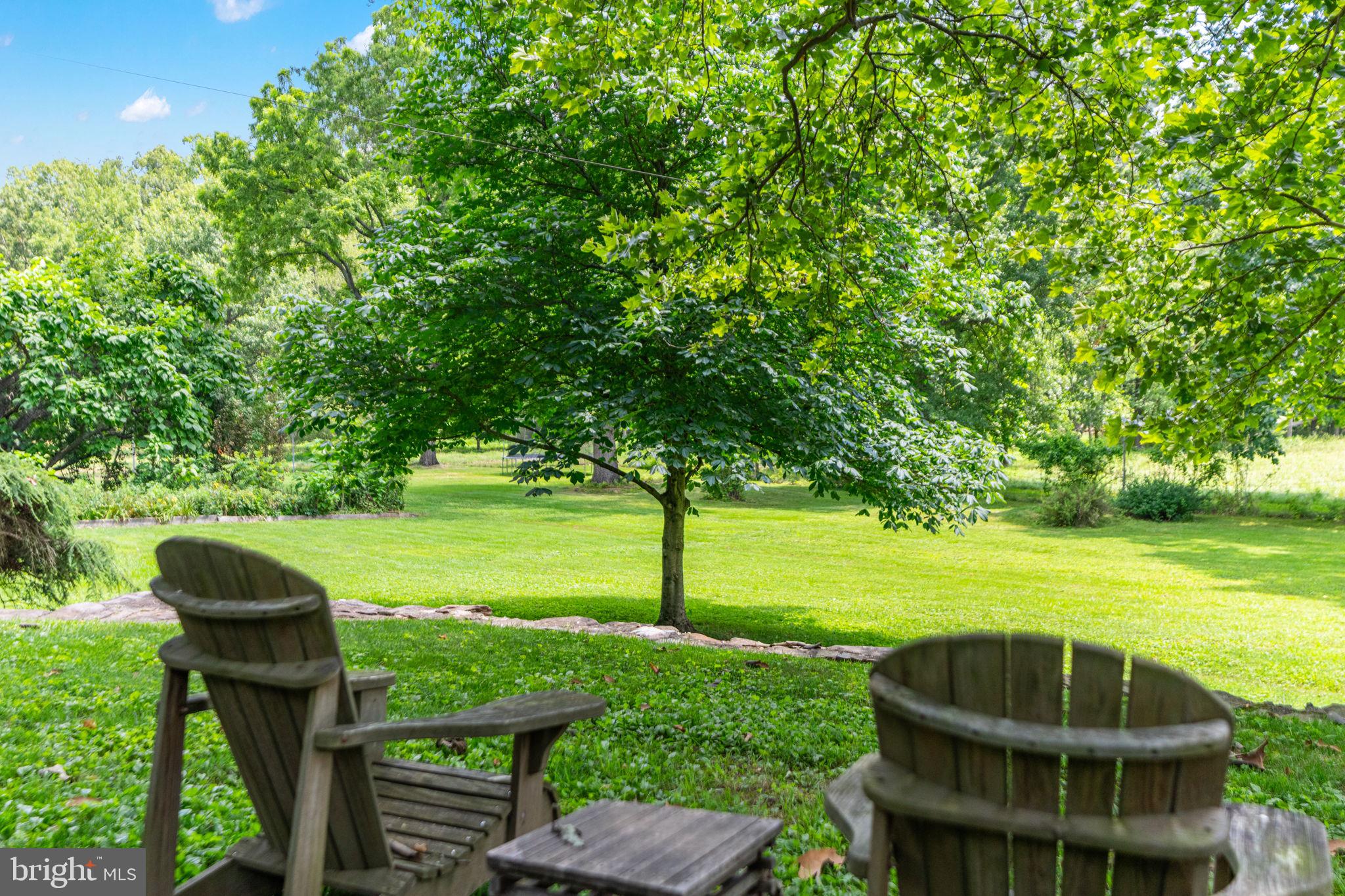 137 Callowhill Road Chalfont, PA 18914 - Photo 38 of 59 a view of a two chairs in a patio with a yard