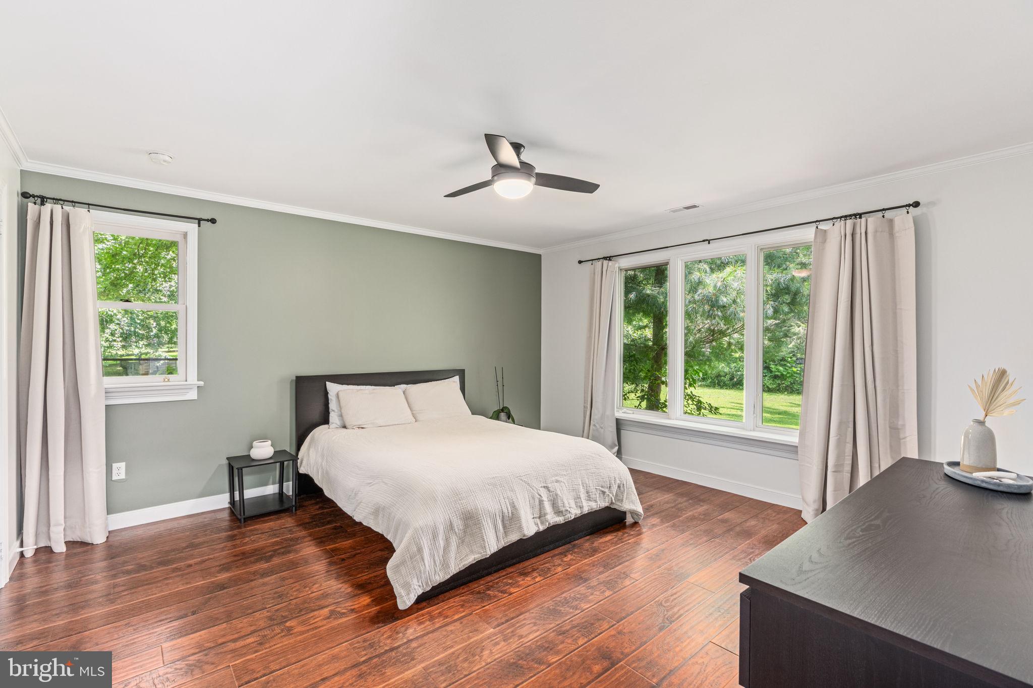 137 Callowhill Road Chalfont, PA 18914 - Photo 48 of 59 a large bedroom with a bed and wooden floor
