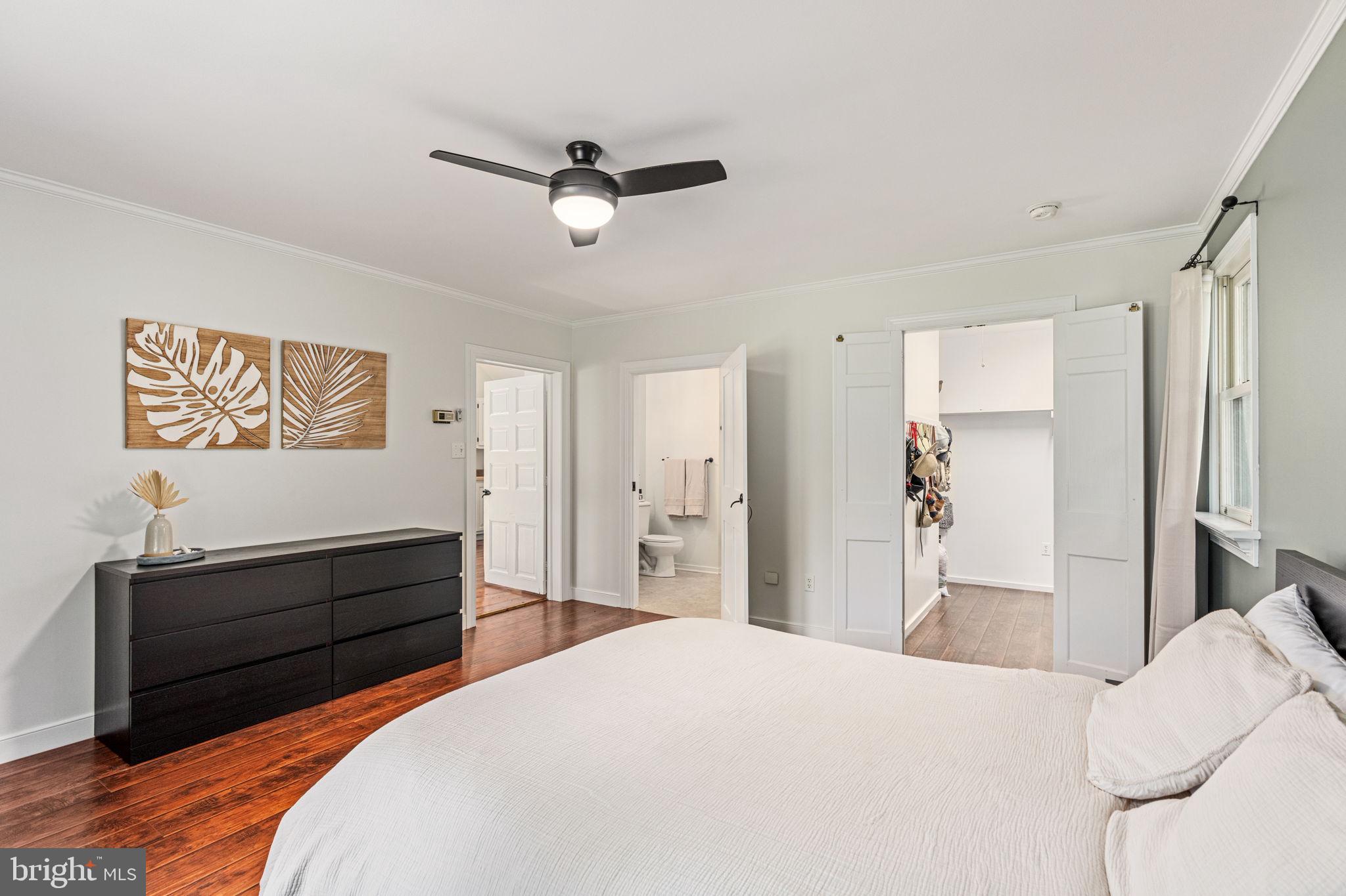 137 Callowhill Road Chalfont, PA 18914 - Photo 49 of 59 a bedroom with a bed and a chandelier