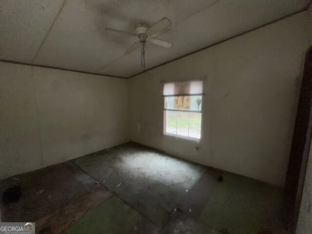 an empty room with a empty space and windows