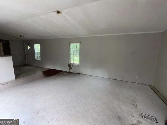 an empty room with windows