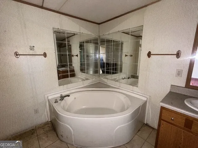 a white bath tub sitting in a bathroom