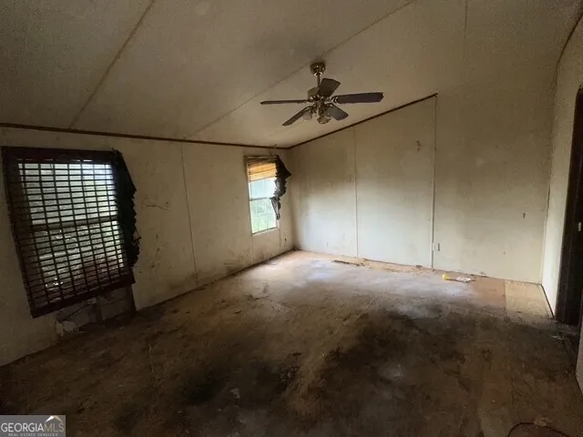 a view of empty room with windows
