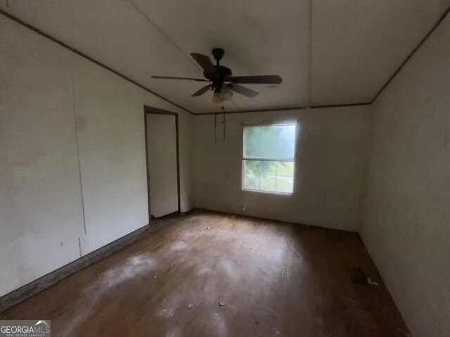 an empty room with a empty space and windows