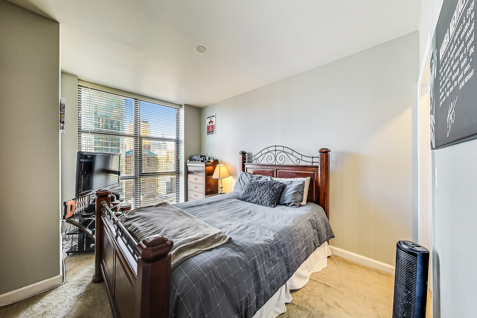 1101 South State Street, Unit 2001 Chicago, IL 60605 - Photo 15 of 24 a bedroom with a bed and a window
