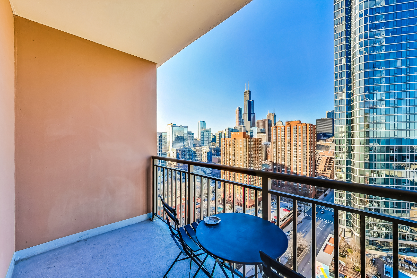 1101 South State Street, Unit 2001 Chicago, IL 60605 - Photo 19 of 24 a view of a city from a balcony with furniture