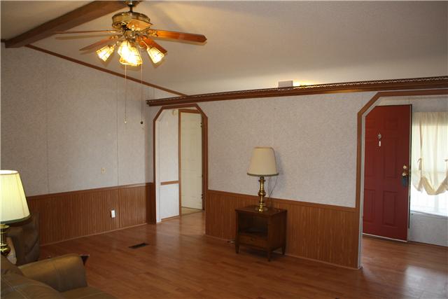 4372 Elkwood Section Road Ardmore, AL 35739 - Photo 5 of 20 a bedroom with a bed and a chandelier