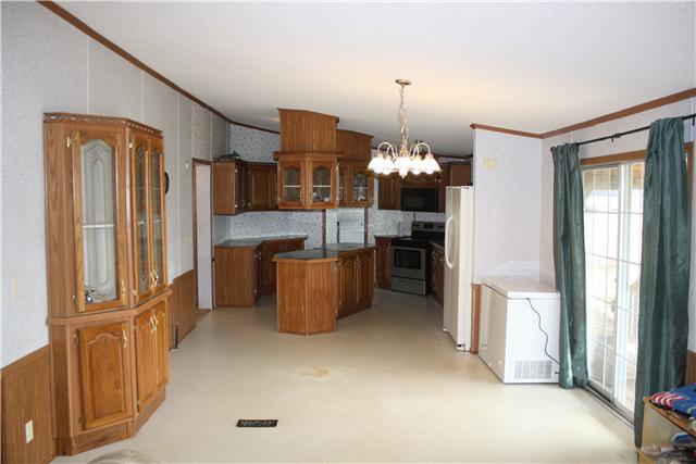 4372 Elkwood Section Road Ardmore, AL 35739 - Photo 7 of 20 a view of a kitchen with furniture and chandelier