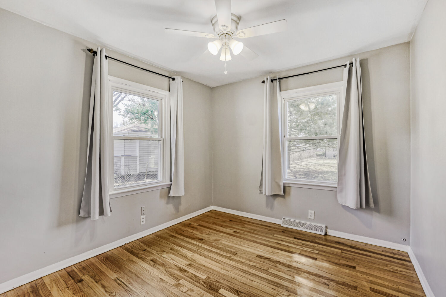 3 Sunset Lane Algonquin, IL 60102 - Photo 16 of 23 a view of empty room with wooden floor and fan