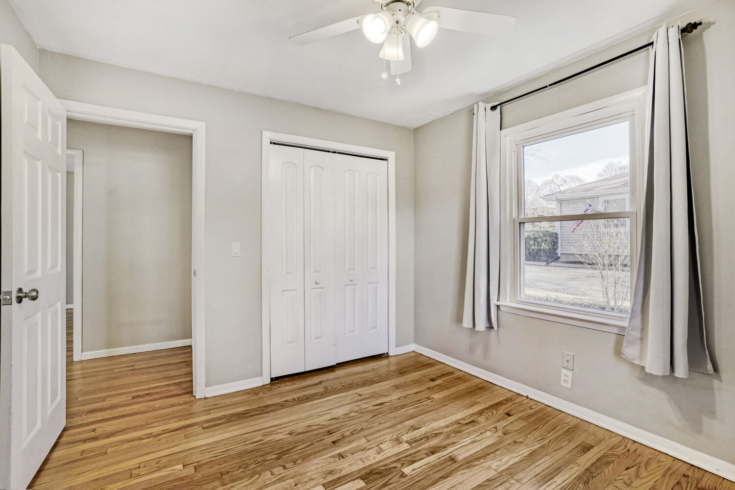 3 Sunset Lane Algonquin, IL 60102 - Photo 17 of 23 a view of an empty room with wooden floor and a window