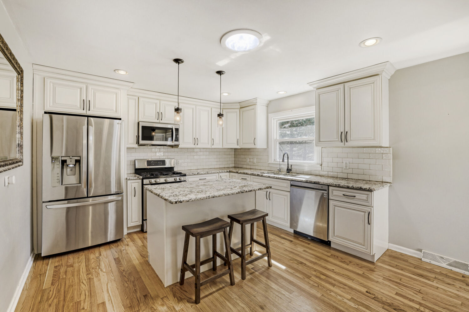 3 Sunset Lane Algonquin, IL 60102 - Photo 8 of 23 a kitchen with stainless steel appliances granite countertop a refrigerator a stove top oven a sink and dishwasher with wooden floor
