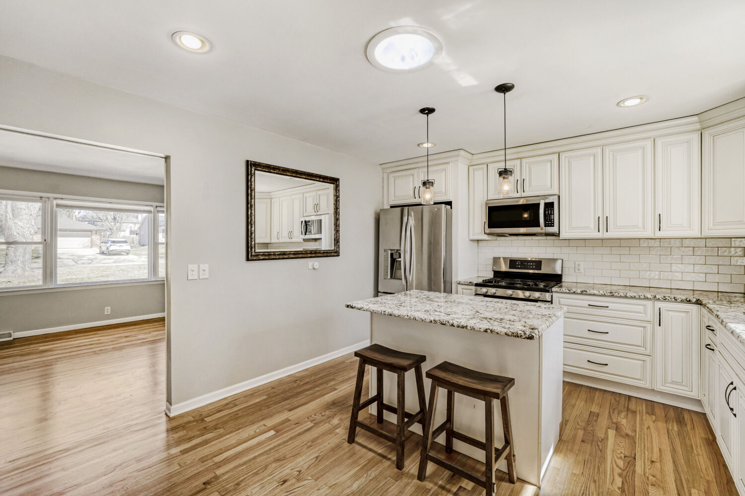 3 Sunset Lane Algonquin, IL 60102 - Photo 9 of 23 a kitchen with stainless steel appliances granite countertop a stove a sink dishwasher and a refrigerator with wooden floor