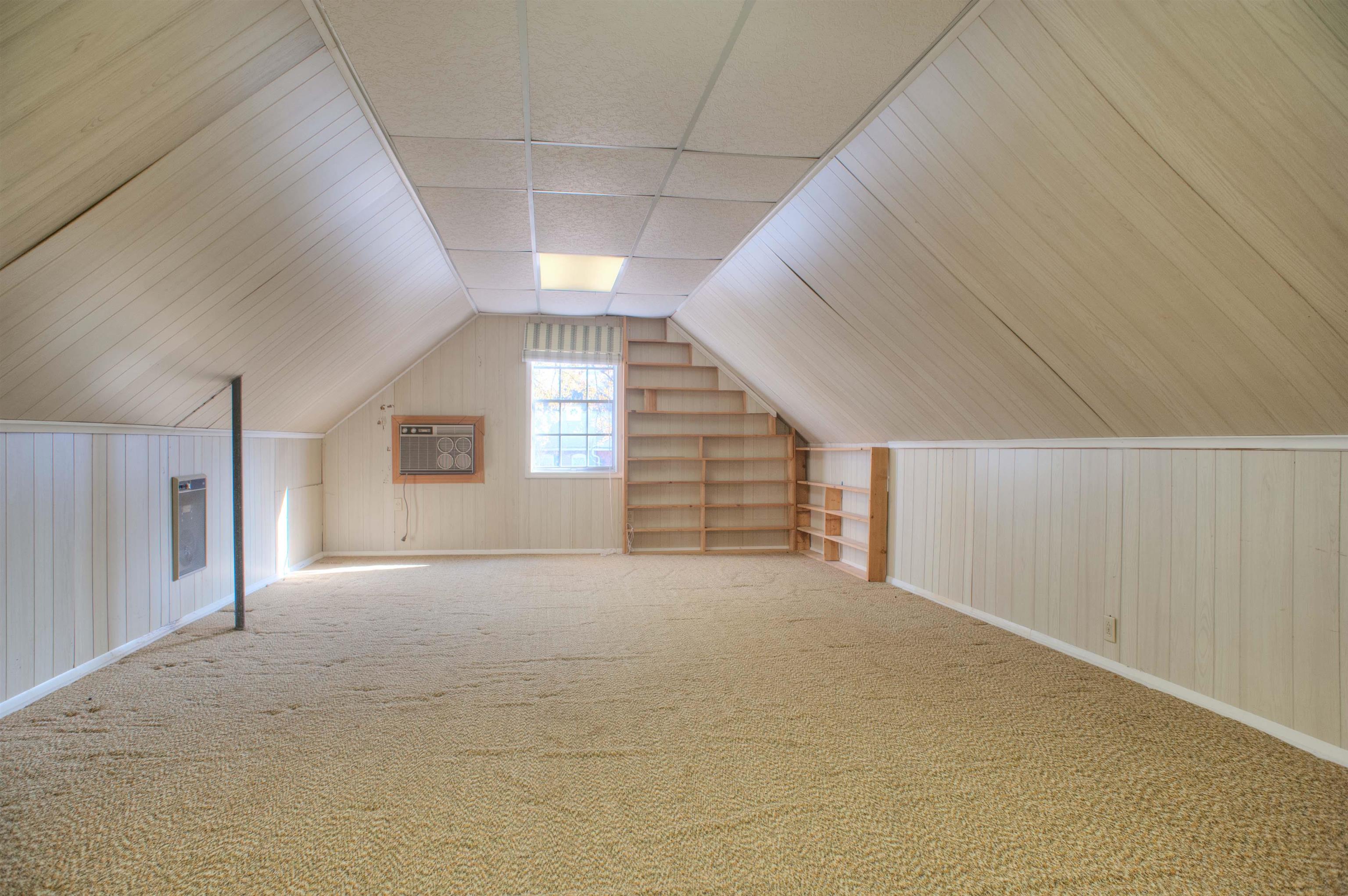 5760 Foxdale Road Memphis, TN 38115 - Photo 17 of 21 Spacious 23x09 Media/Playroom with Coffered Ceiling and Built-In Bookshelves