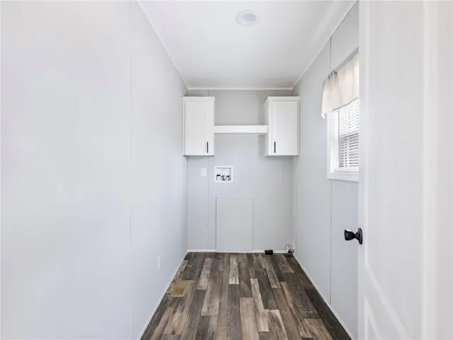 a view of a hardwood floor in a room