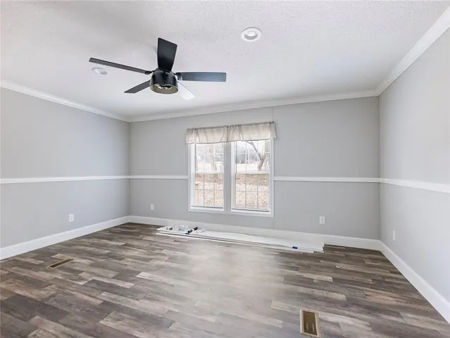 an empty room with a empty space and windows