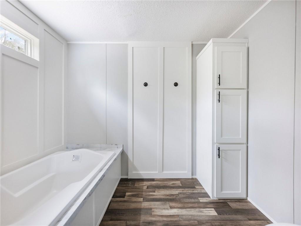 5230 Bogus Road Commerce, GA 30530 - Photo 17 of 45 a spacious bathroom with a bathtub and shower