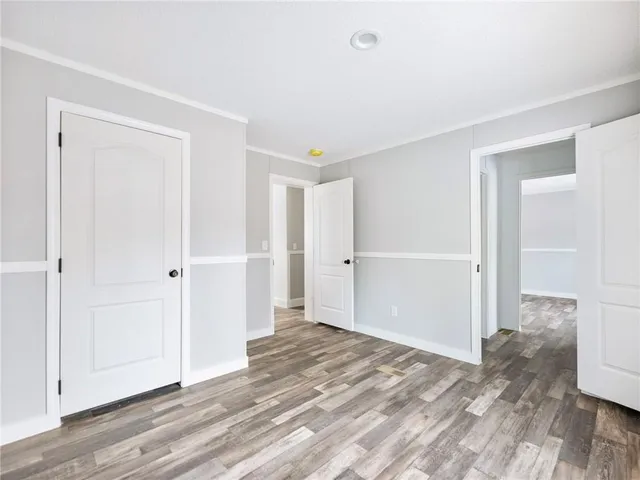 a view of a room with wooden floor
