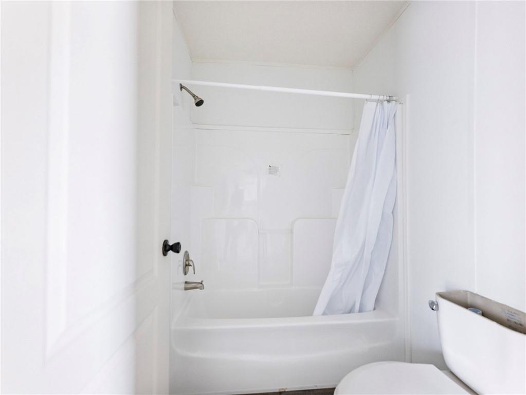 5230 Bogus Road Commerce, GA 30530 - Photo 23 of 45 a bathroom with a bathtub and a toilet