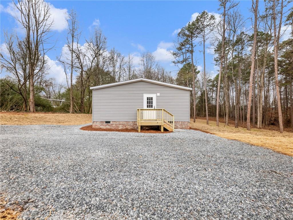 5230 Bogus Road Commerce, GA 30530 - Photo 34 of 45 a view of backyard of house with trees