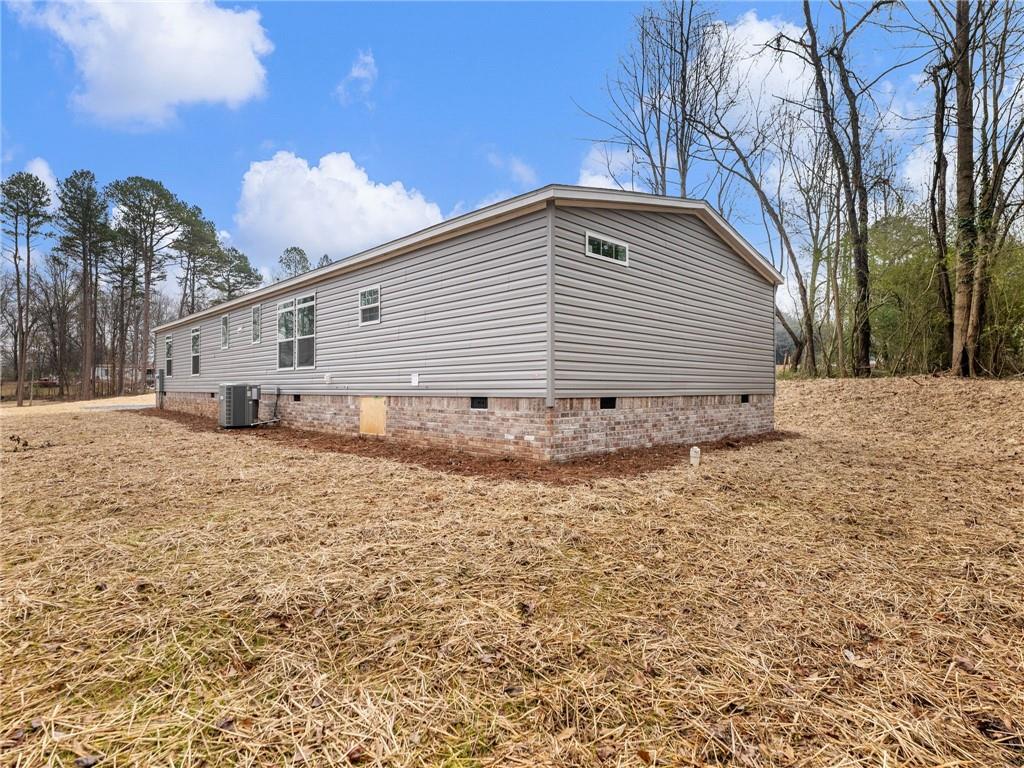 5230 Bogus Road Commerce, GA 30530 - Photo 41 of 45 a backyard of a house with large trees