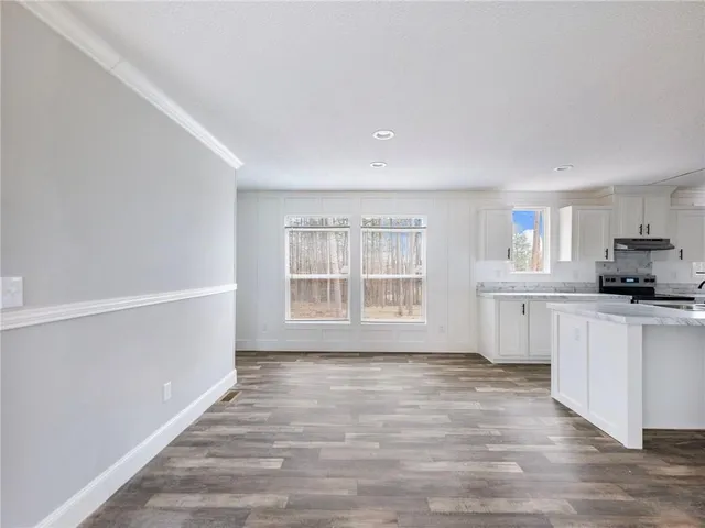 a view of a kitchen with electric appliances