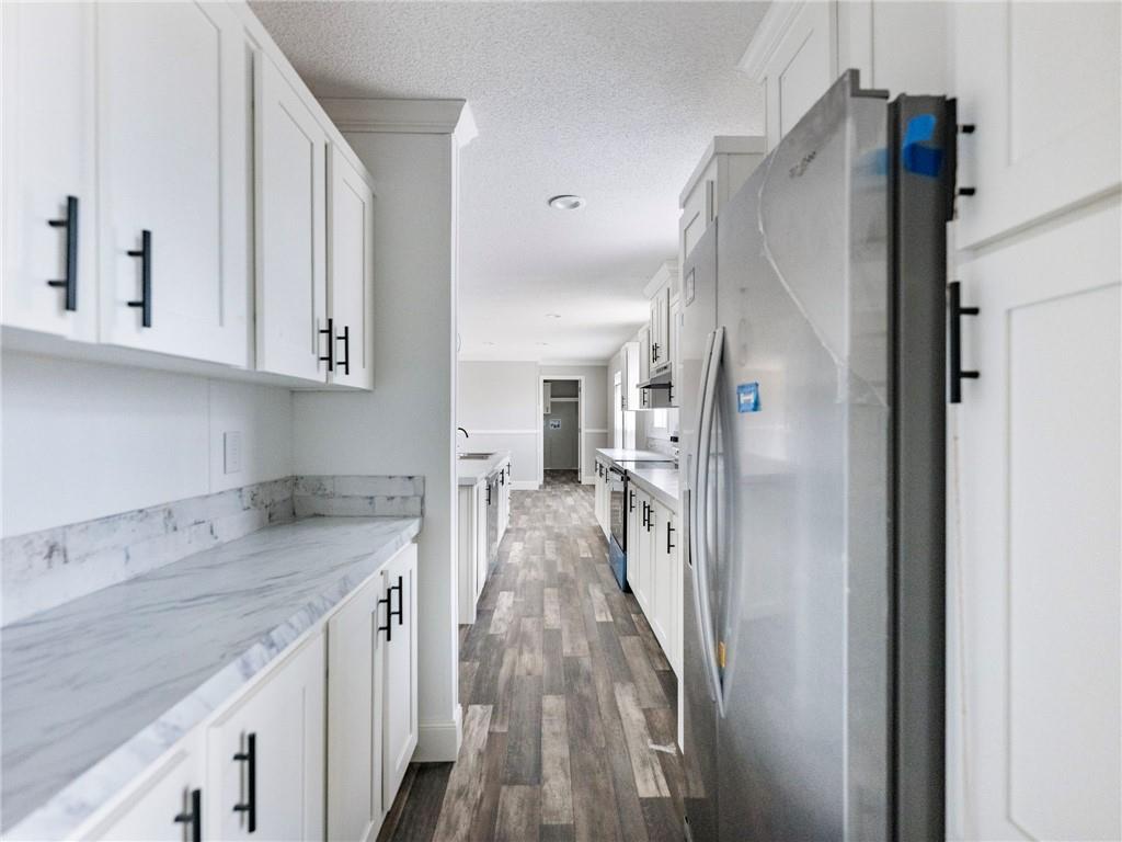 5230 Bogus Road Commerce, GA 30530 - Photo 9 of 45 a view of a kitchen with a sink and dishwasher