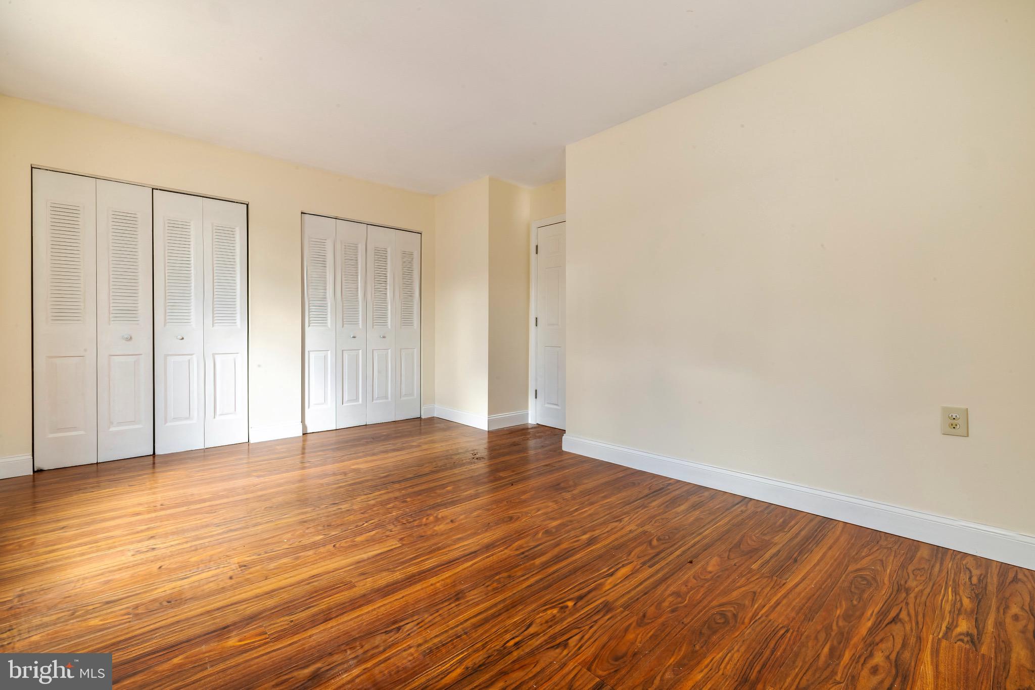 1209 Timber Creek Road Clementon, NJ 08021 - Photo 15 of 23 a view of an empty room with wooden floor