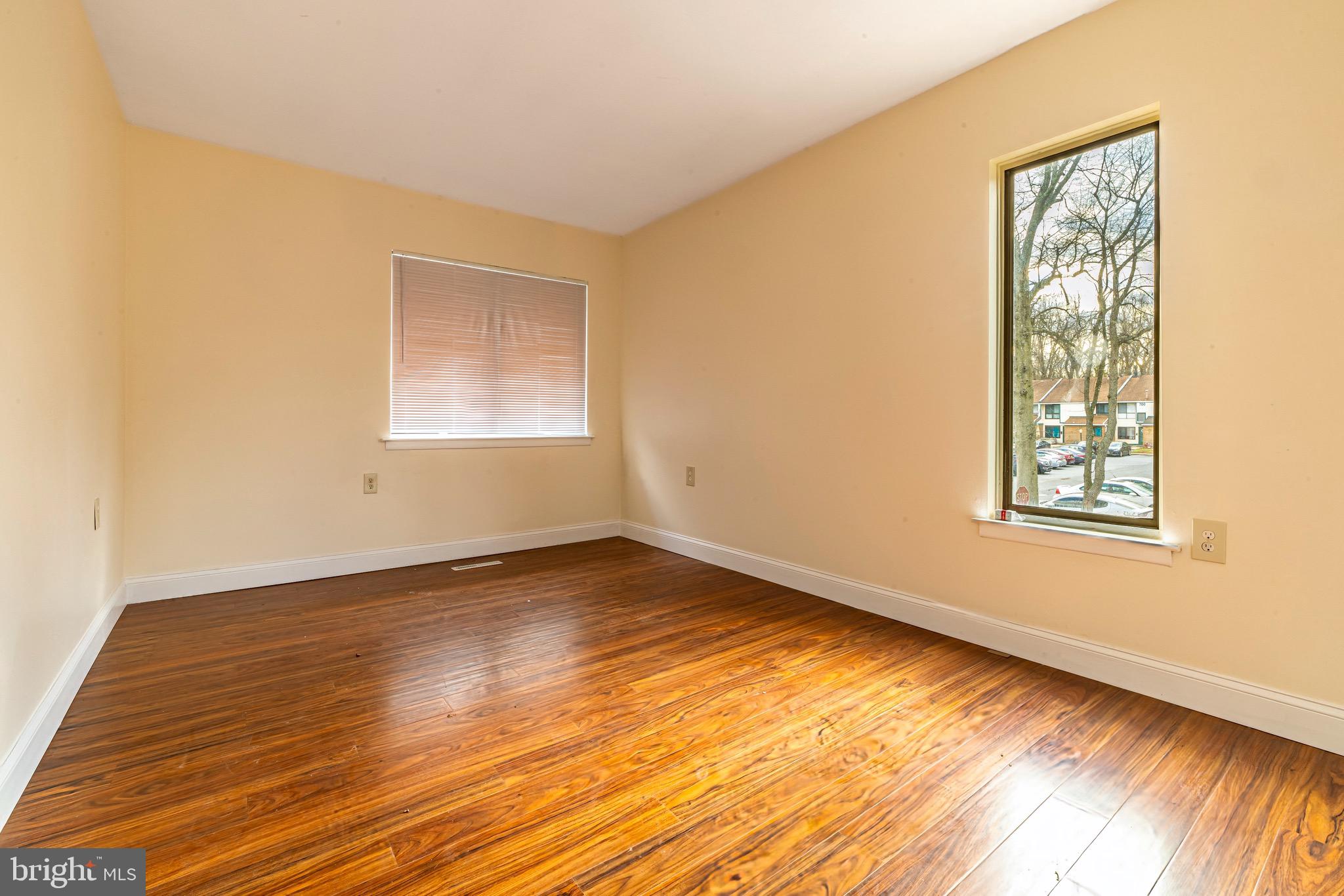 1209 Timber Creek Road Clementon, NJ 08021 - Photo 16 of 23 a view of an empty room with wooden floor and a window