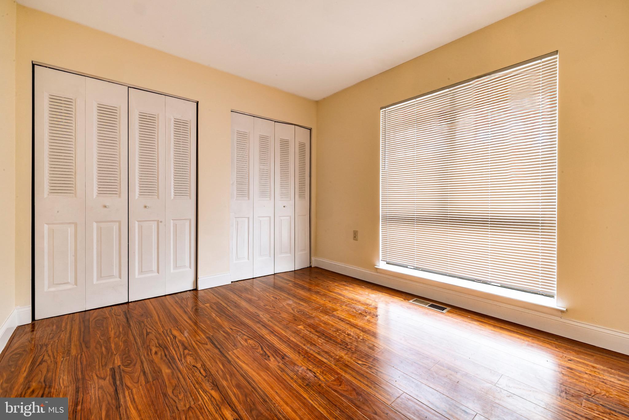 1209 Timber Creek Road Clementon, NJ 08021 - Photo 17 of 23 an empty room with wooden floor and windows