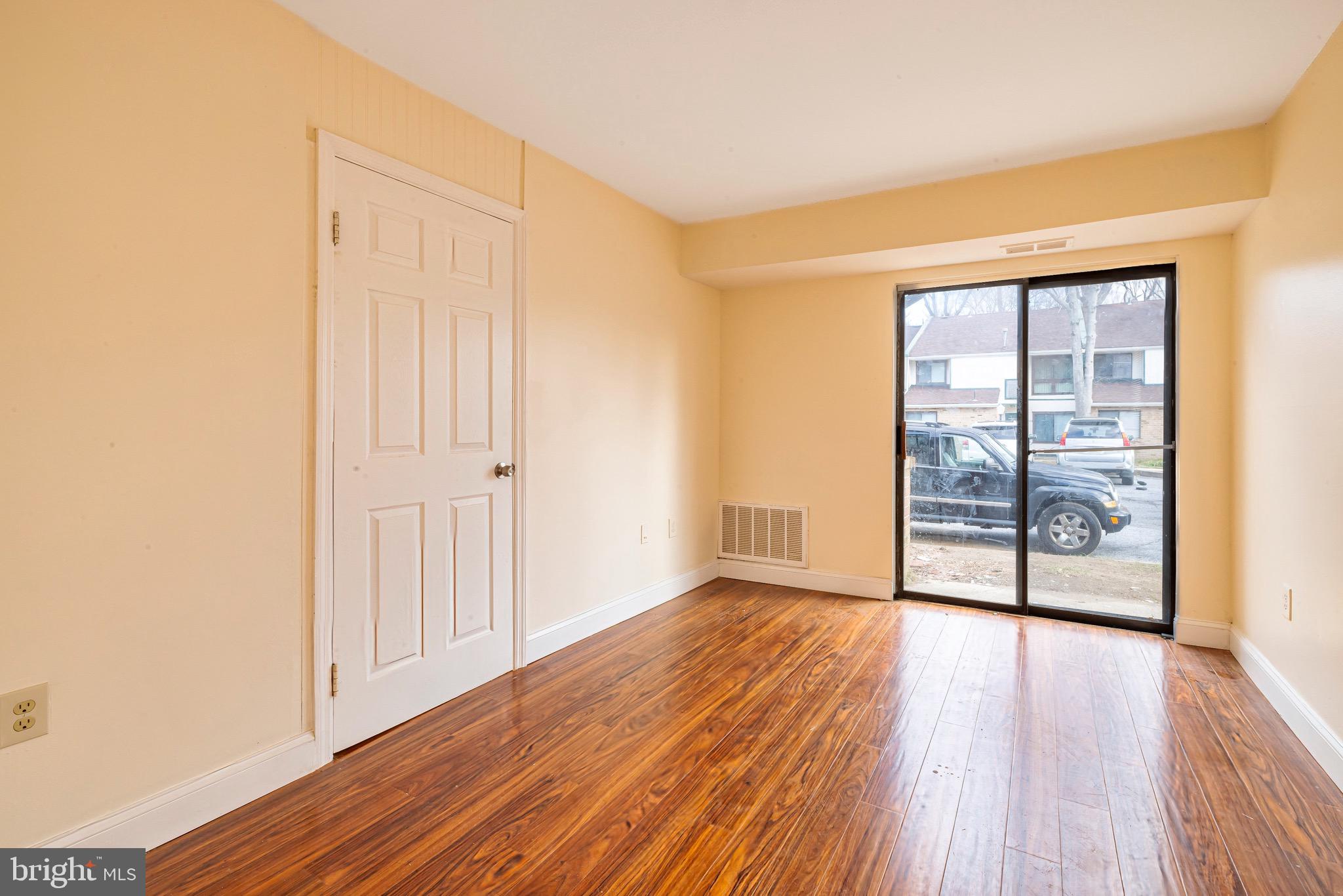 1209 Timber Creek Road Clementon, NJ 08021 - Photo 19 of 23 an empty room with wooden floor and windows