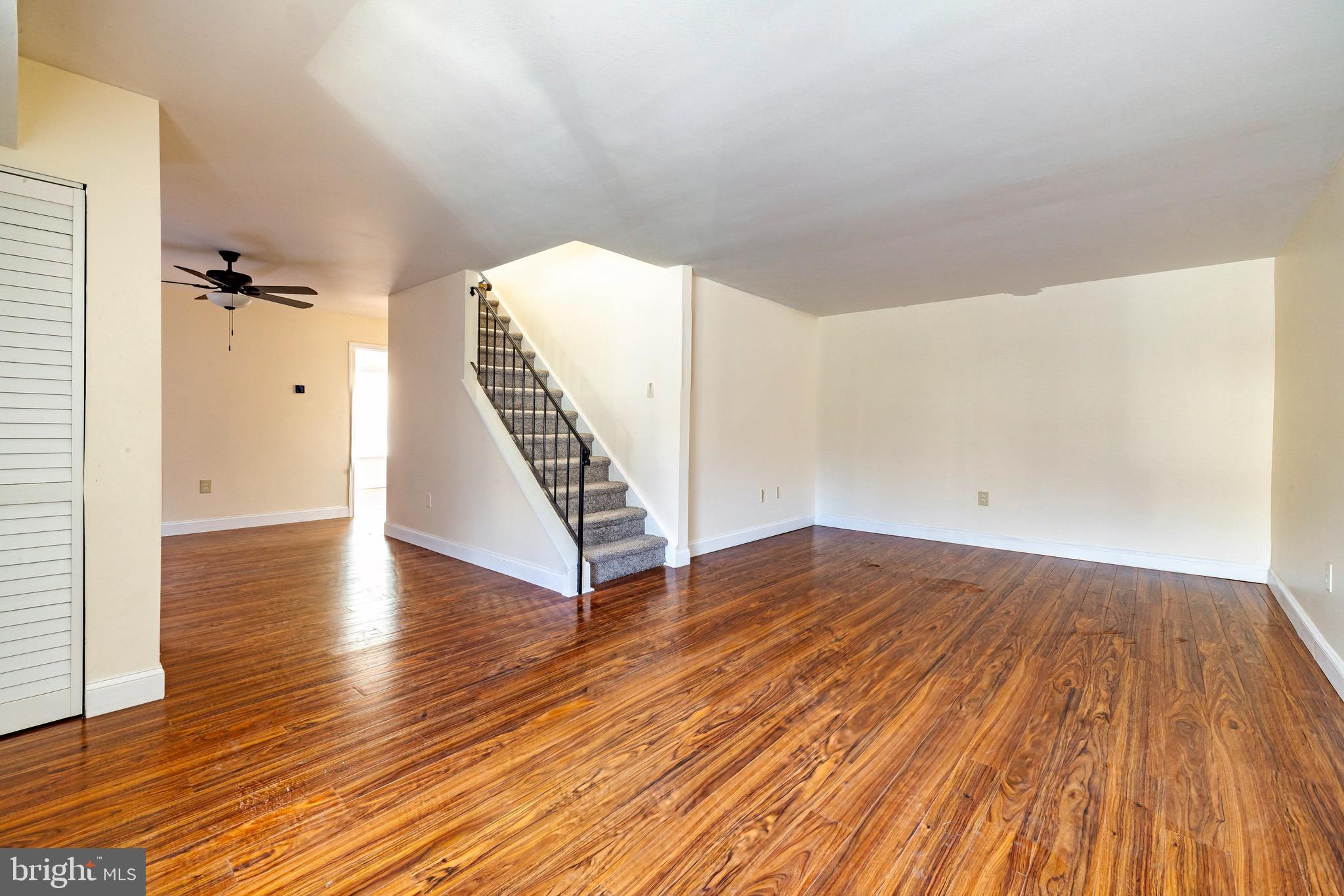1209 Timber Creek Road Clementon, NJ 08021 - Photo 4 of 23 wooden floor in a hall with an empty room