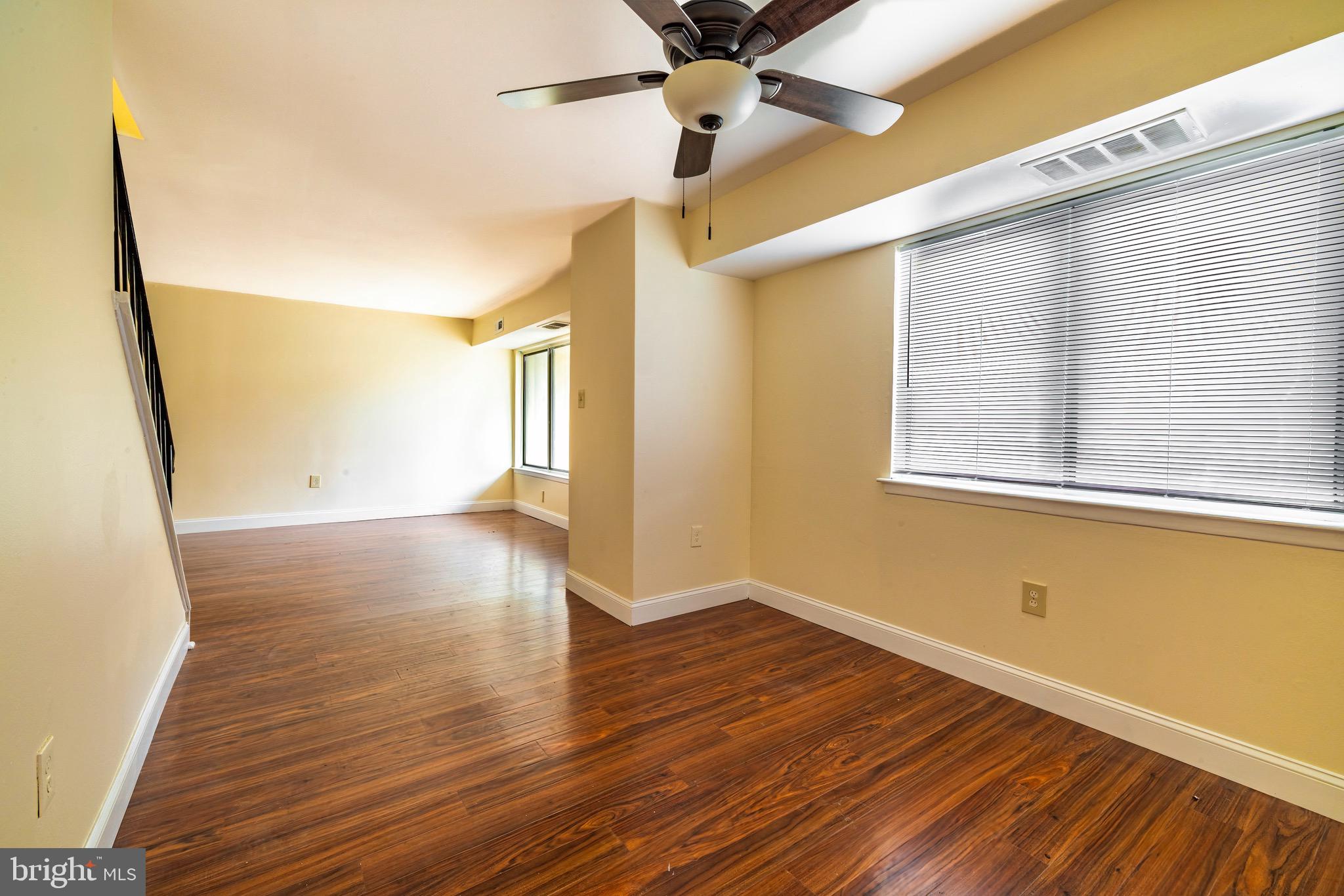 1209 Timber Creek Road Clementon, NJ 08021 - Photo 6 of 23 a view of empty room with wooden floor and fan