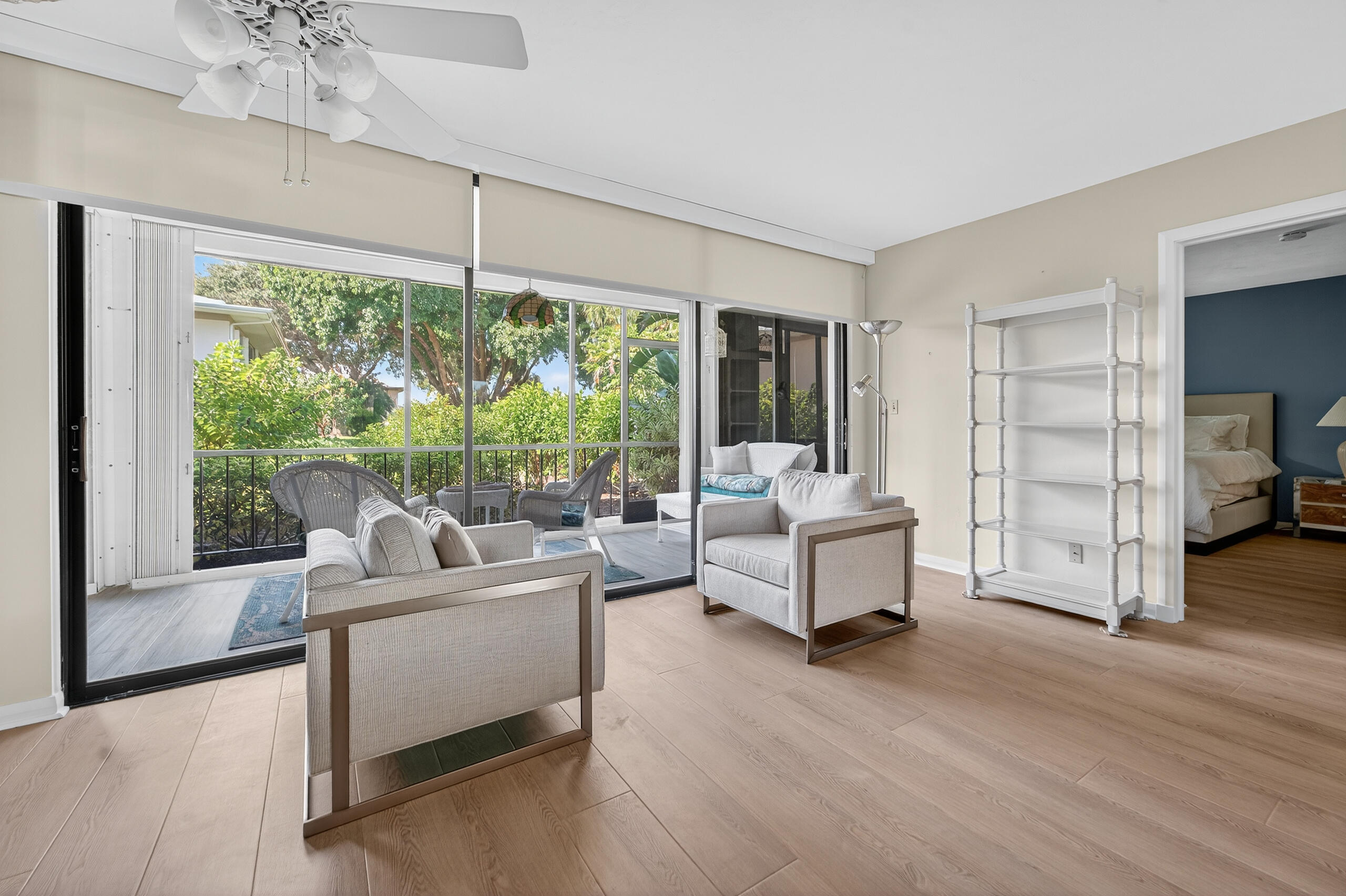 6 Concourse Drive, Unit A Jupiter, FL 33469 - Photo 14 of 49 a living room with furniture and a large window