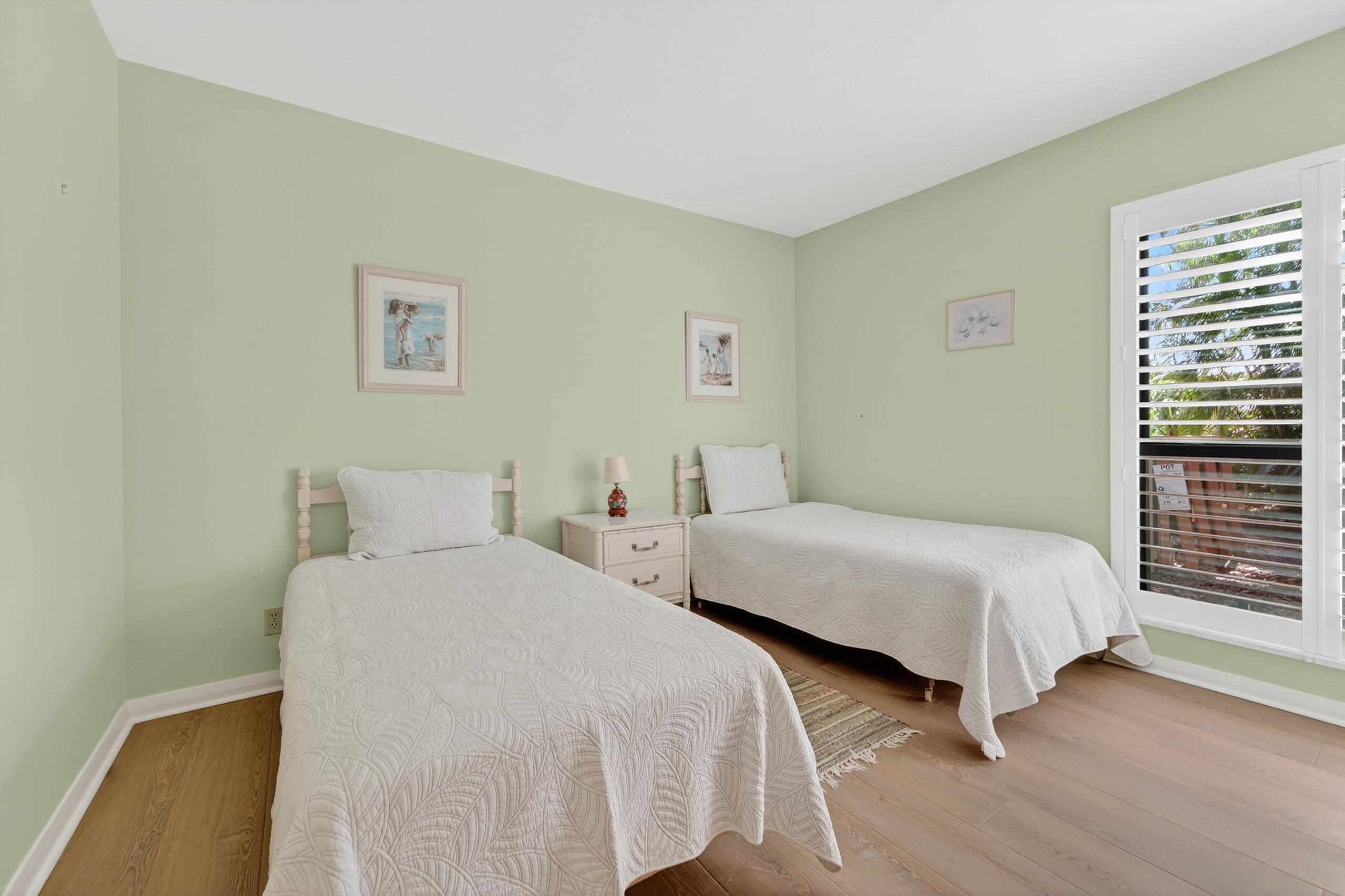 6 Concourse Drive, Unit A Jupiter, FL 33469 - Photo 19 of 49 a bedroom with two beds and a window