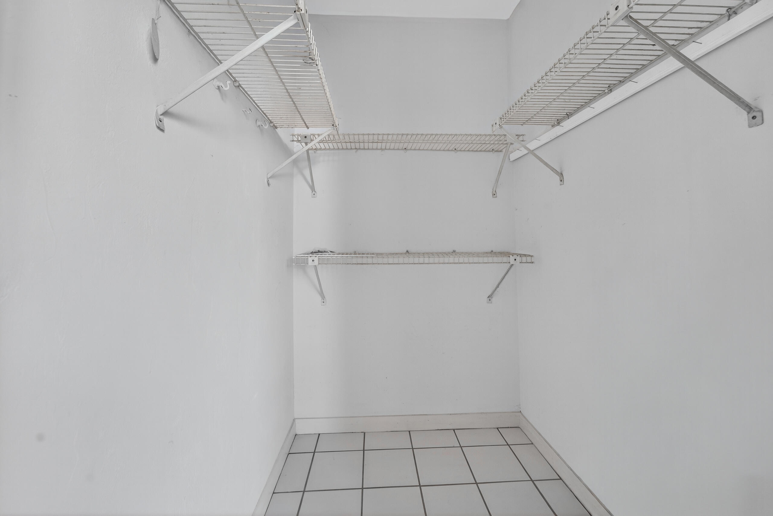 6 Concourse Drive, Unit A Jupiter, FL 33469 - Photo 25 of 49 a view of an empty walk in closet