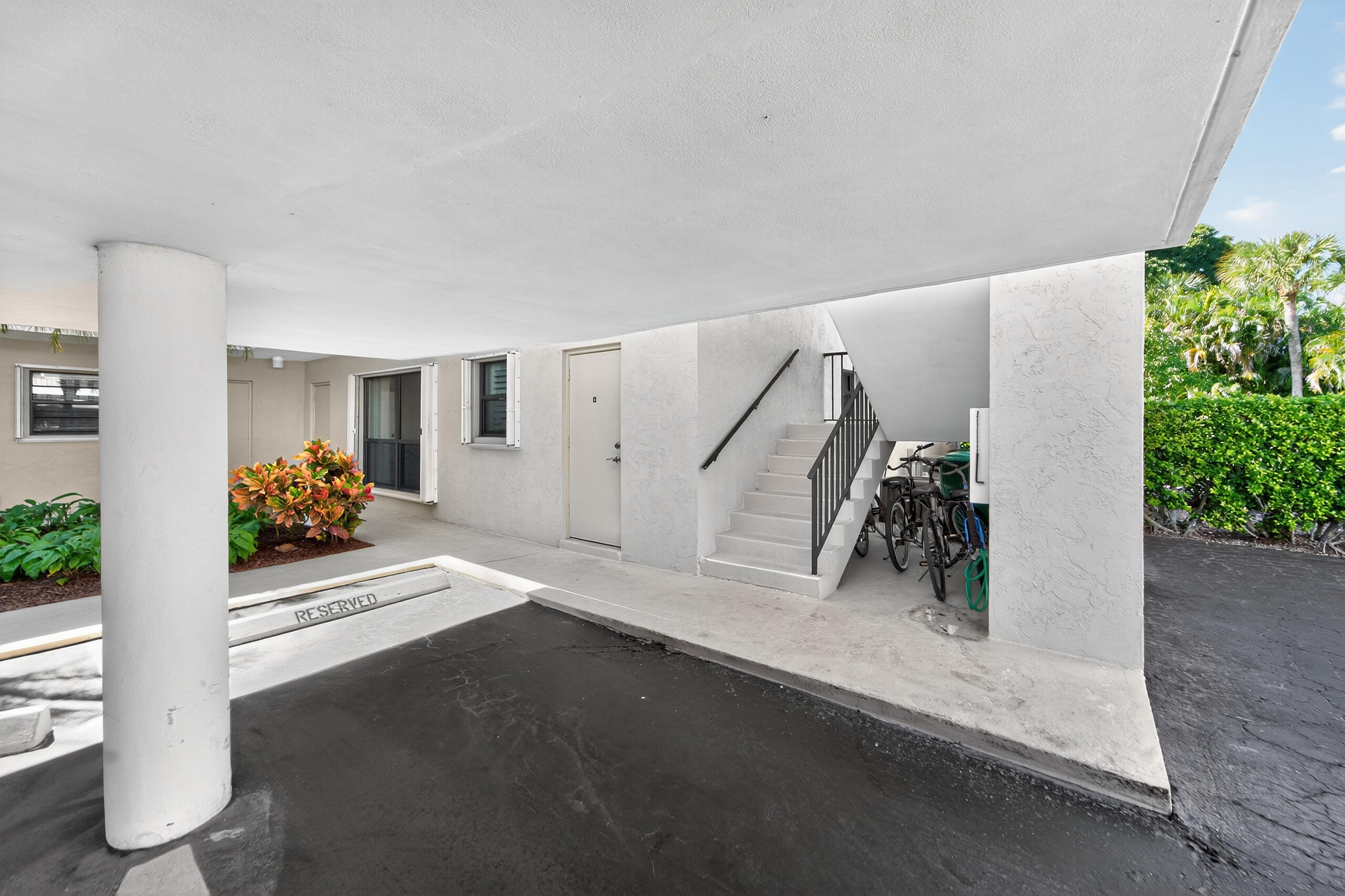 6 Concourse Drive, Unit A Jupiter, FL 33469 - Photo 27 of 49 a view of a room with gym equipment and a couch