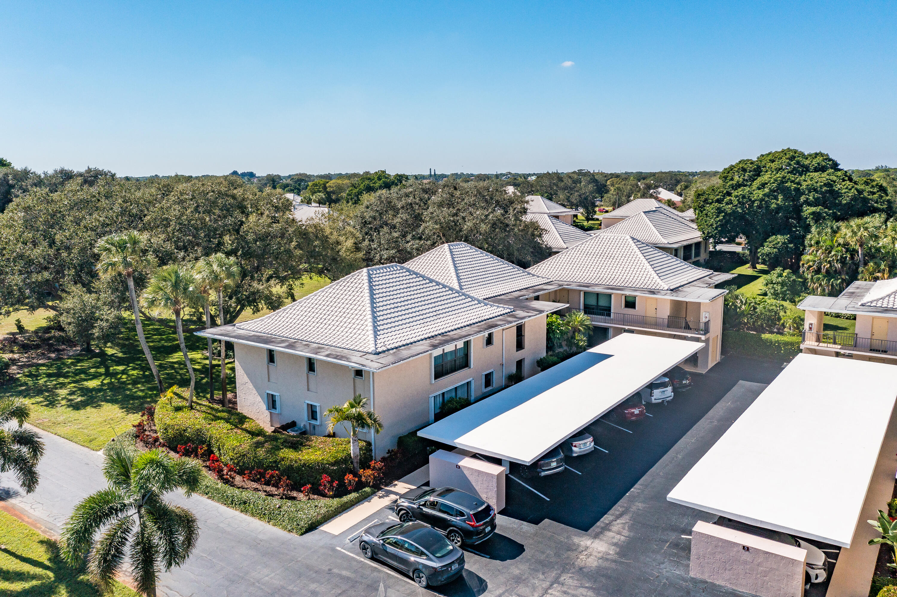 6 Concourse Drive, Unit A Jupiter, FL 33469 - Photo 29 of 49 an aerial view of a house with a big yard