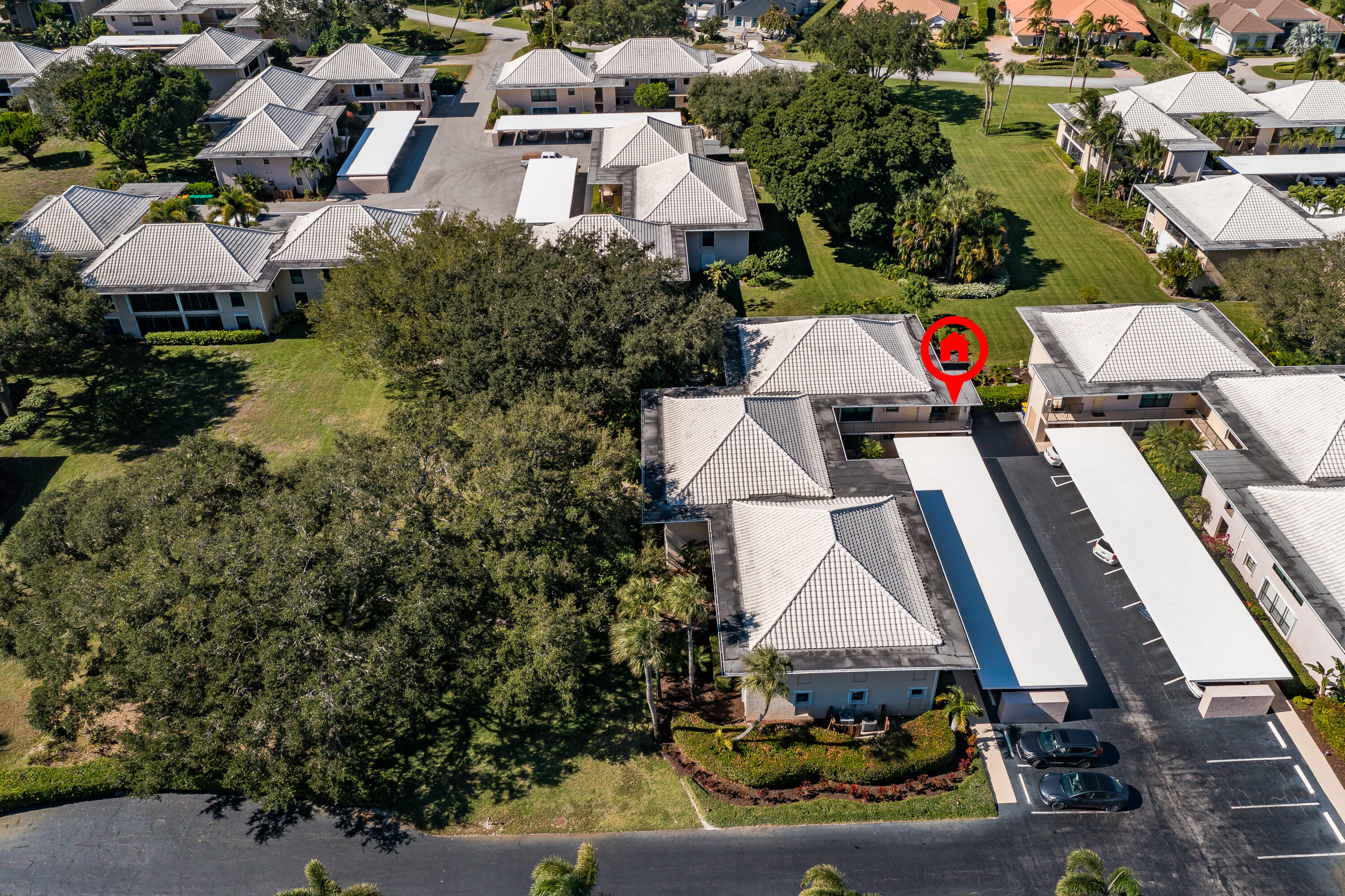 6 Concourse Drive, Unit A Jupiter, FL 33469 - Photo 31 of 49 an aerial view of multiple houses with yard