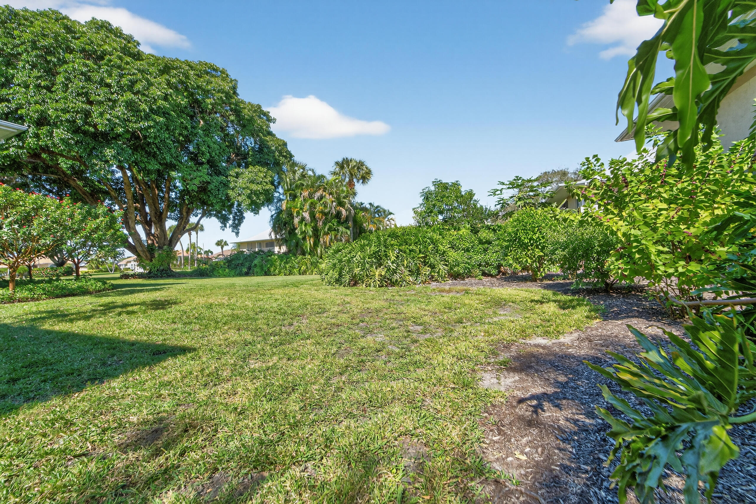 6 Concourse Drive, Unit A Jupiter, FL 33469 - Photo 35 of 49 a view of yard with green space