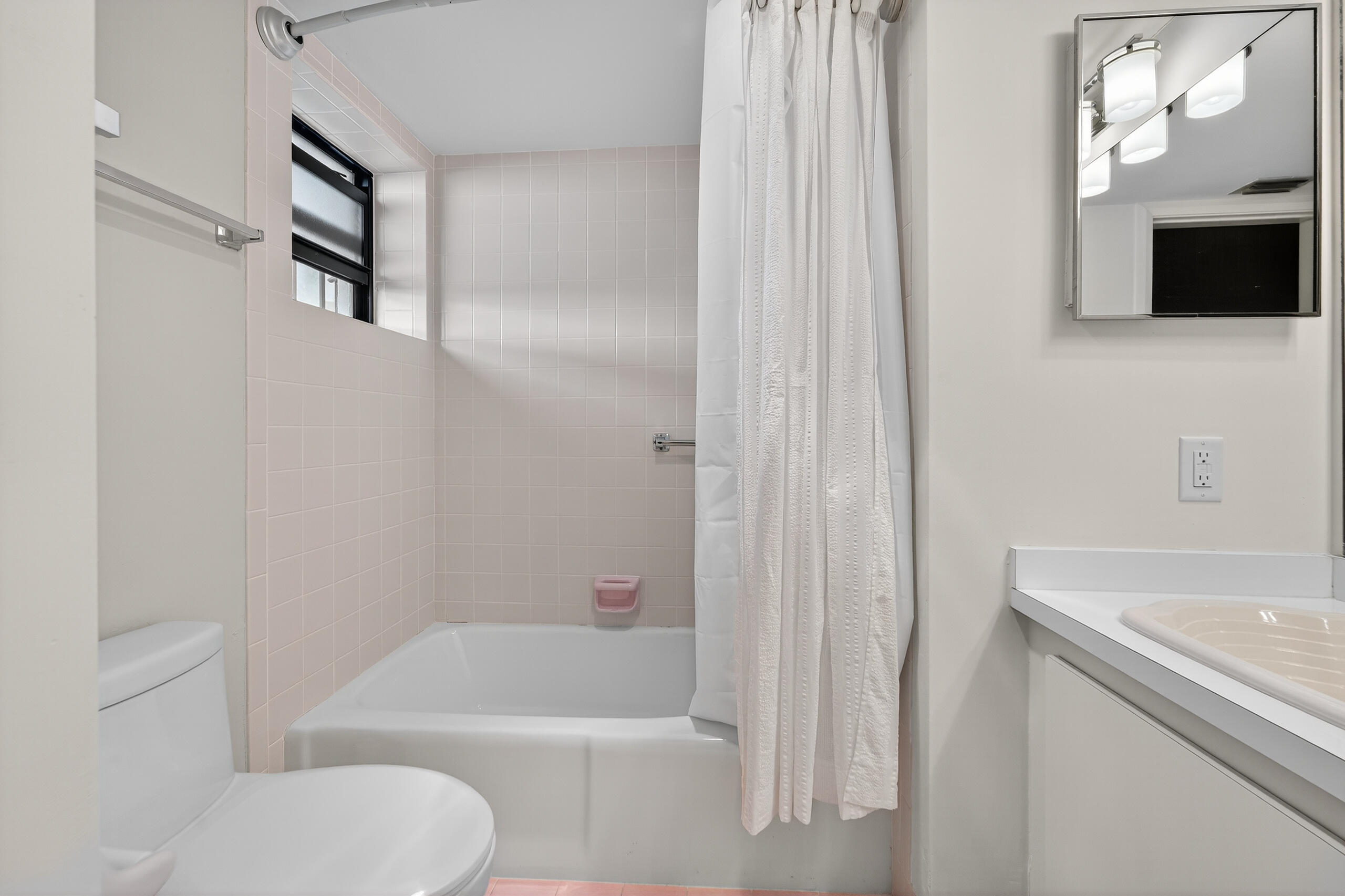 6 Concourse Drive, Unit A Jupiter, FL 33469 - Photo 10 of 49 a bathroom with a sink toilet and shower